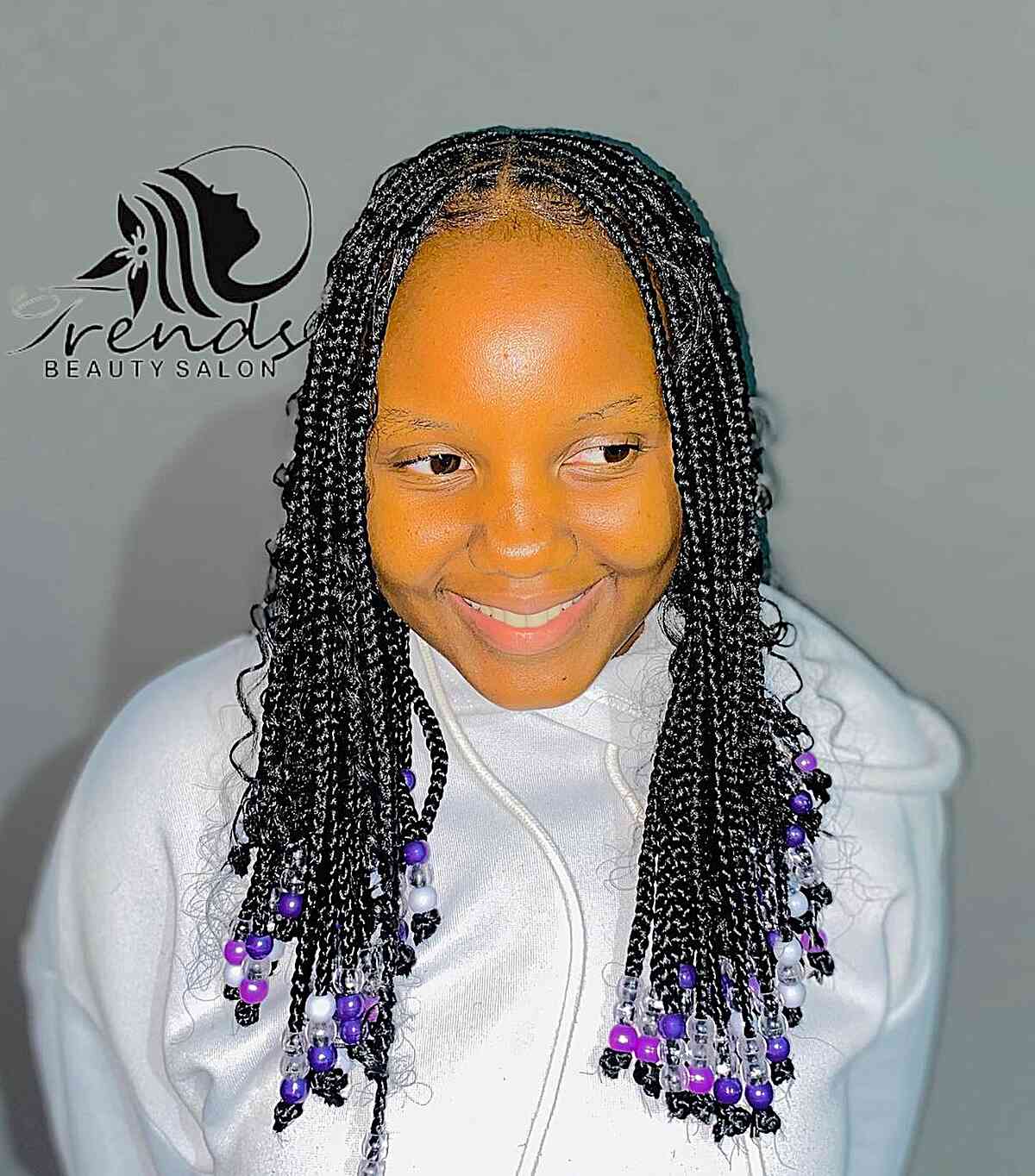 Medium-Length Knotless Goddess Braids with Purple Beads