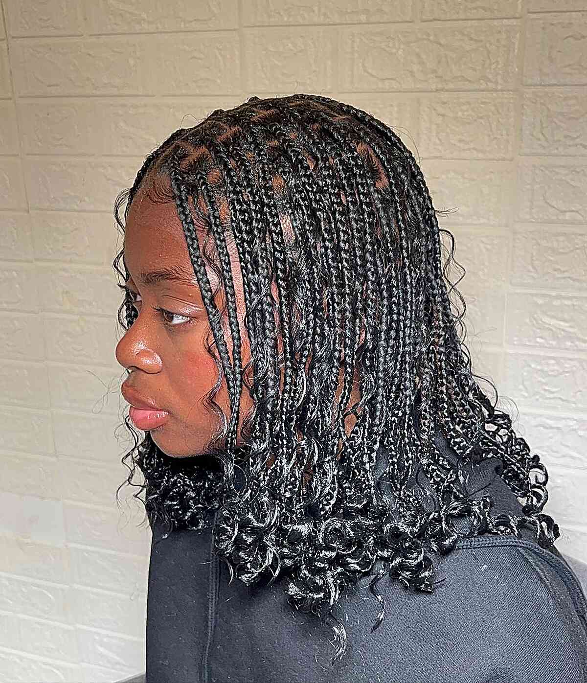 Small Boho braids with a shoulder length with curly ends