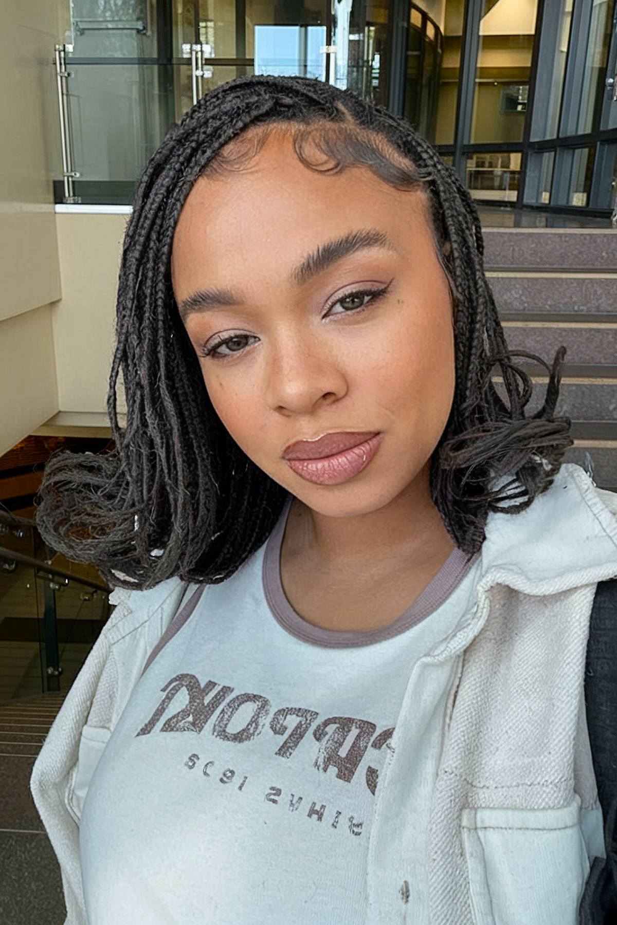 French curls along the shoulder length with black braids