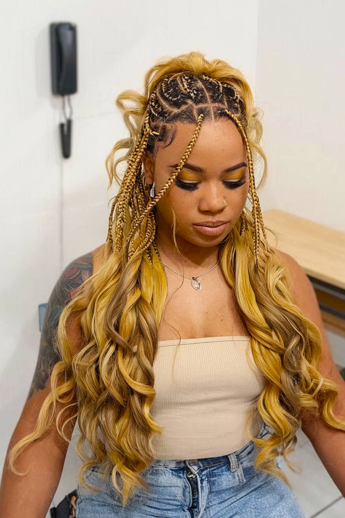 Blonde box braids with French curls at a ponytail half follow -up