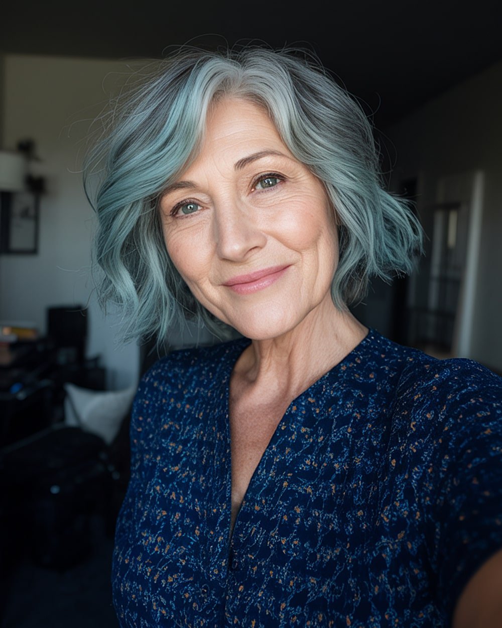 Smoky teal layered bob with soft waves, trendy short bob hairstyle for women over 60 wanting a youthful pop of color