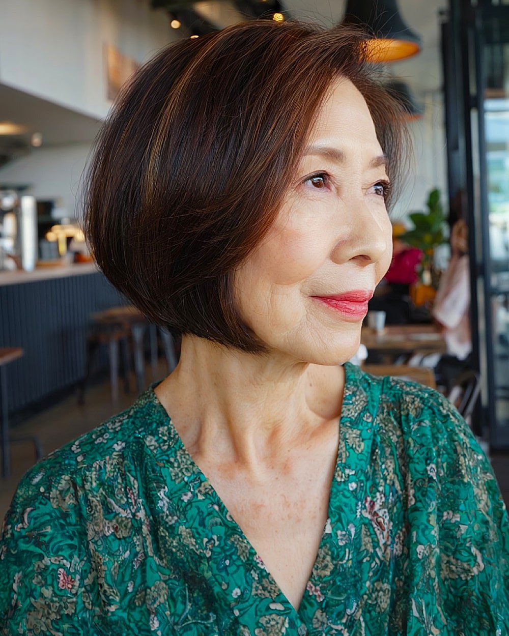Tapered mocha bob with sleek rounded ends, elegant short bob style for women over 60 with straight fine hair