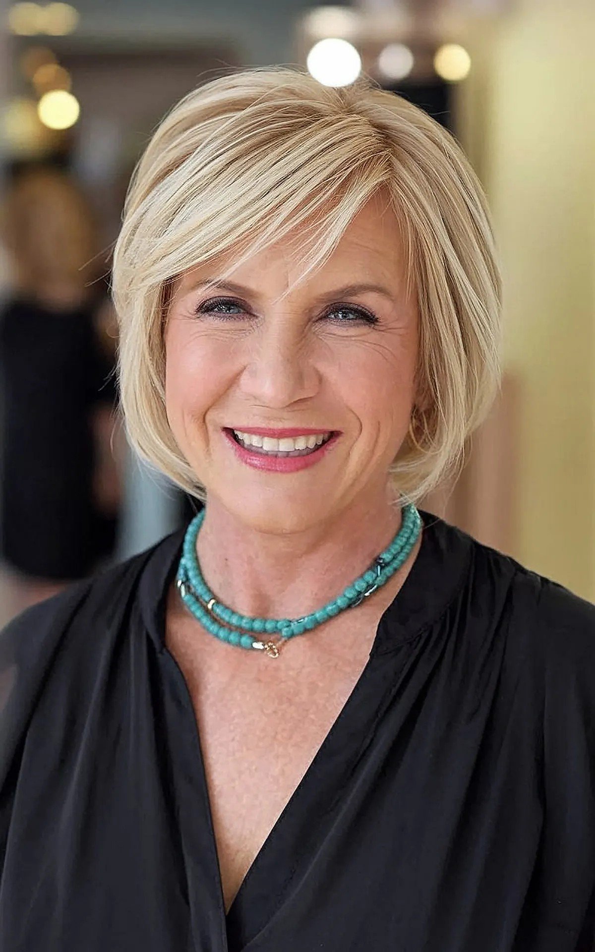Short Piecey Blonde Side-Parted Bob Hairstyle for 60-year-olds