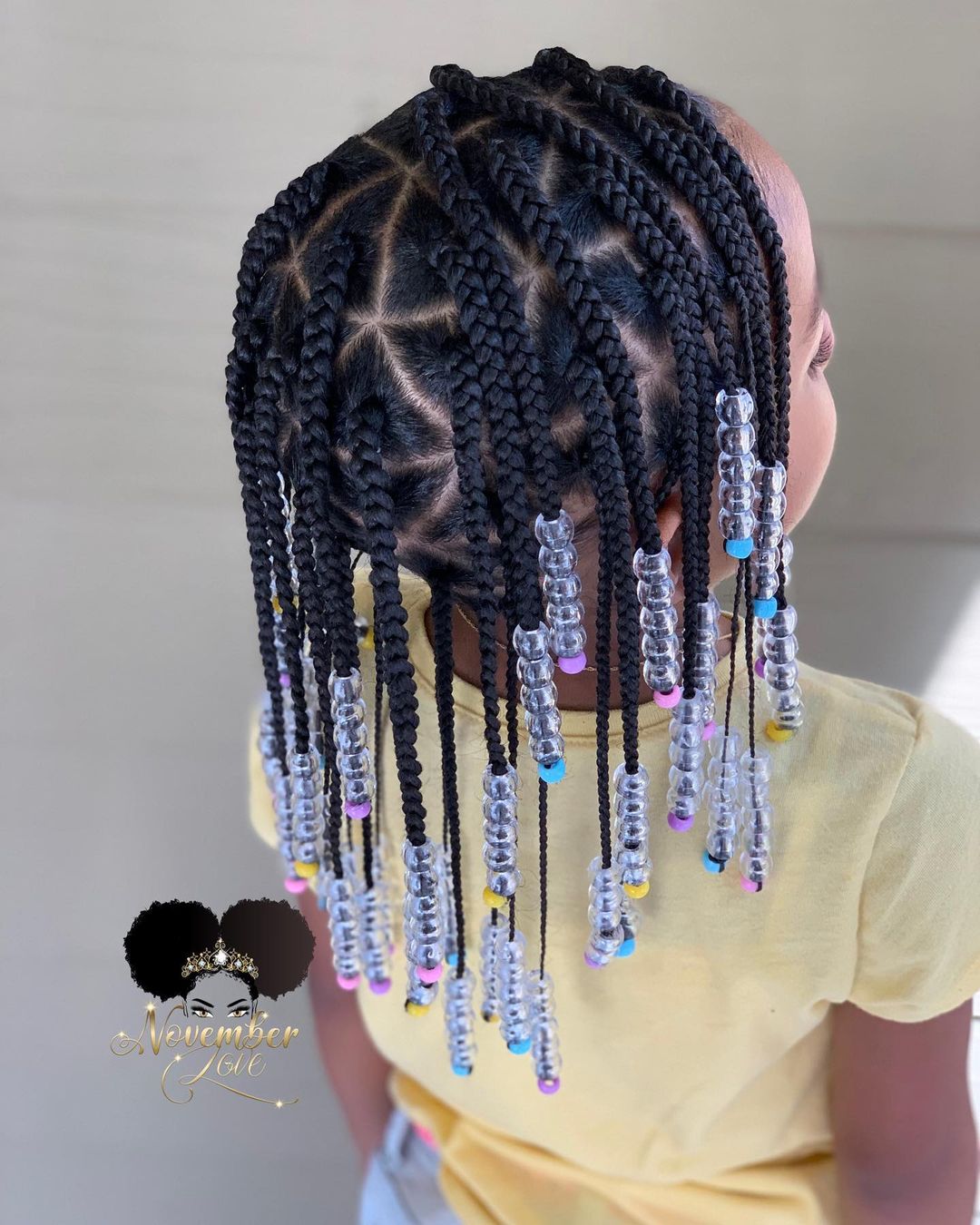Triangle box braids for a small girl with beads