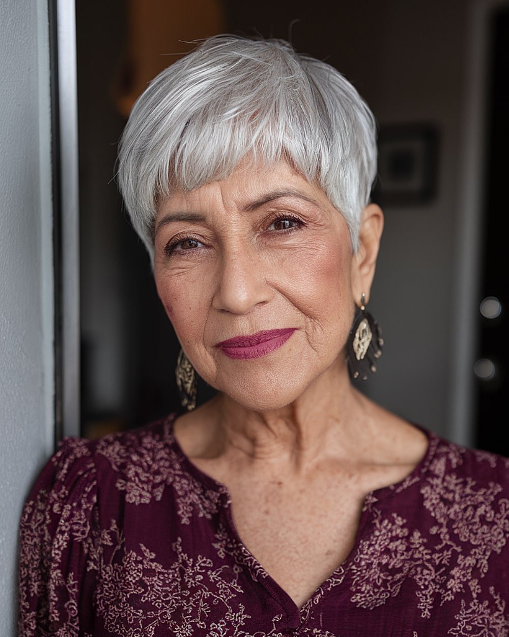 Mushroom pixie with frosted silver tones and short fringe for fine mature hair over 60