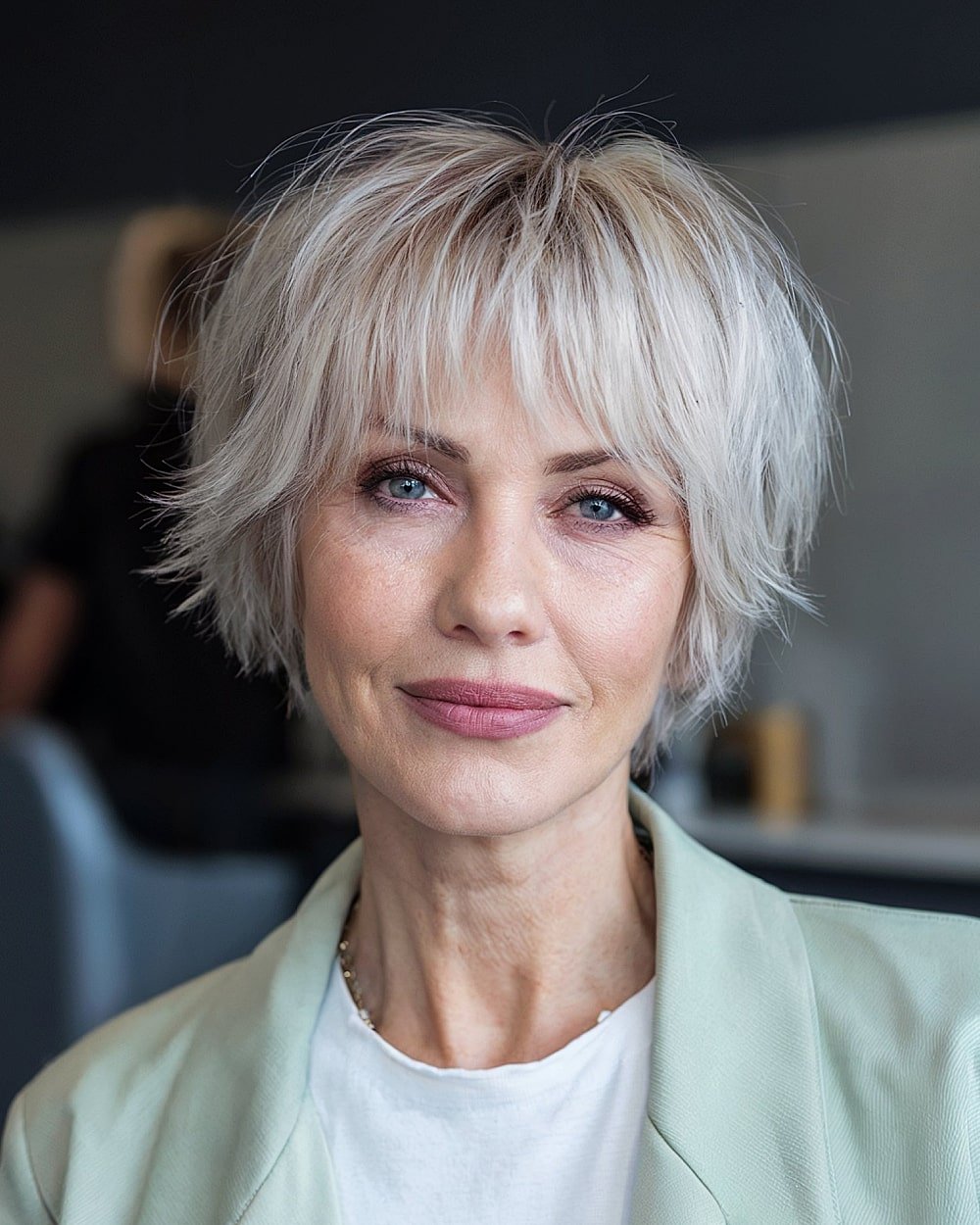 Ash blonde micro shag with choppy layers and wispy fringe for fine hair over 60