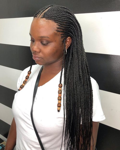 Sleek micro braids with a middle part