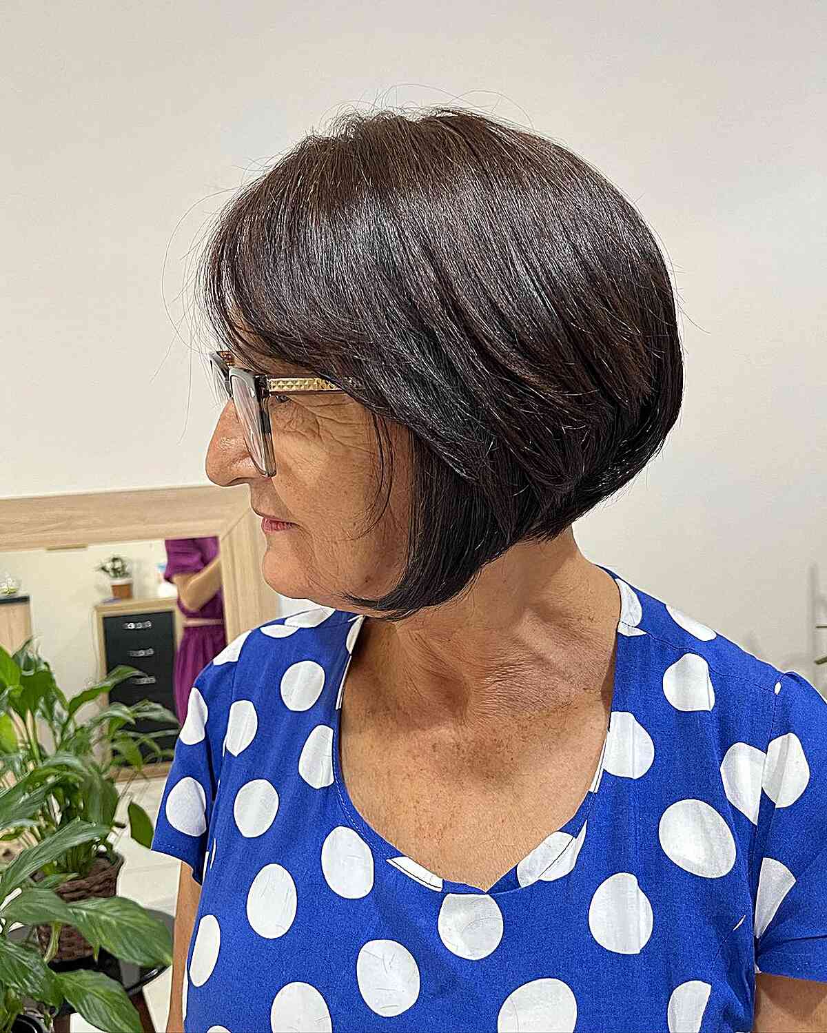 Chin-Length Graduated Bob Cut with Side Bangs for 60-year-olds with Glasses