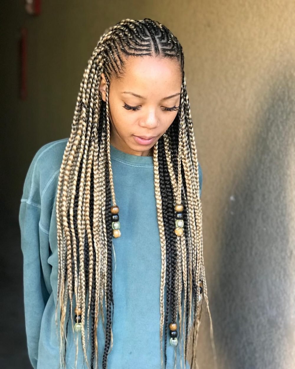Modern blond brands with beads and crnrows