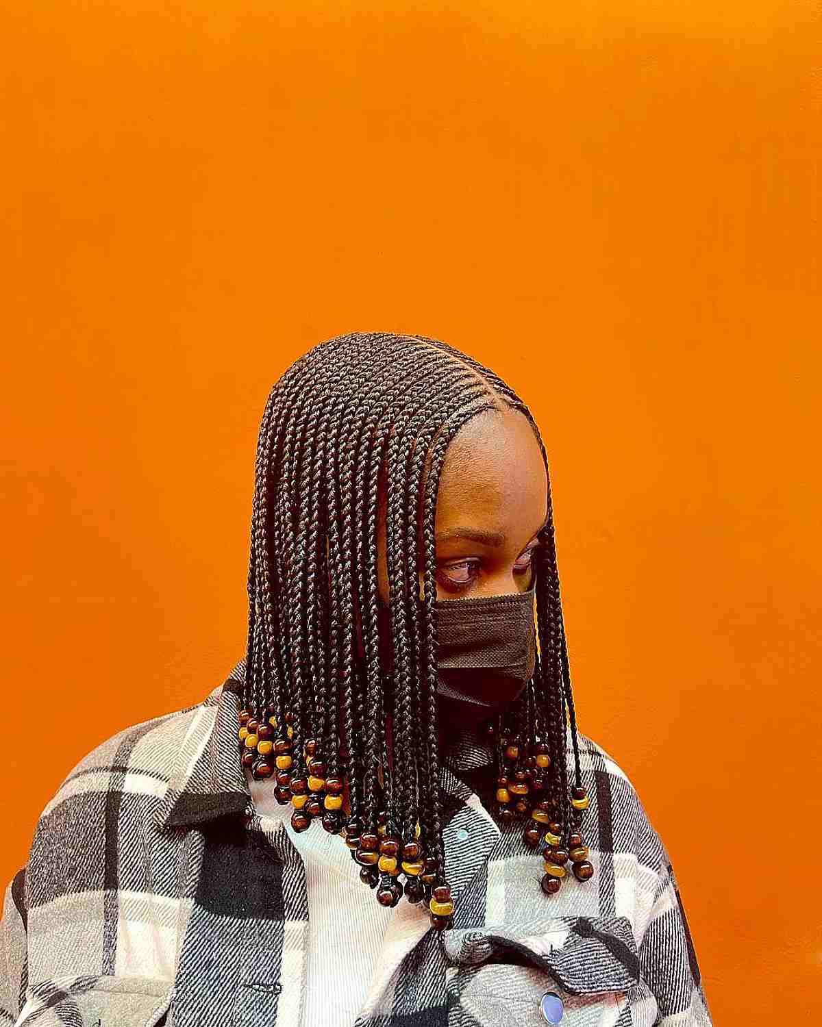 Medium length box braids with beads