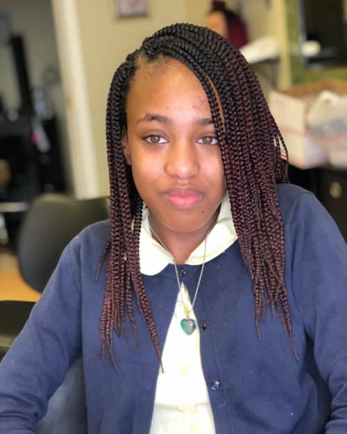 Simple box braids medium length with a side part