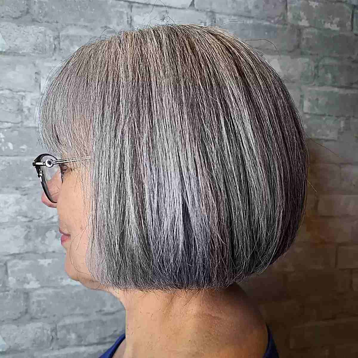 Chin-Grazing Round Gray Bob with Wispy Bangs for Seniors Over 60