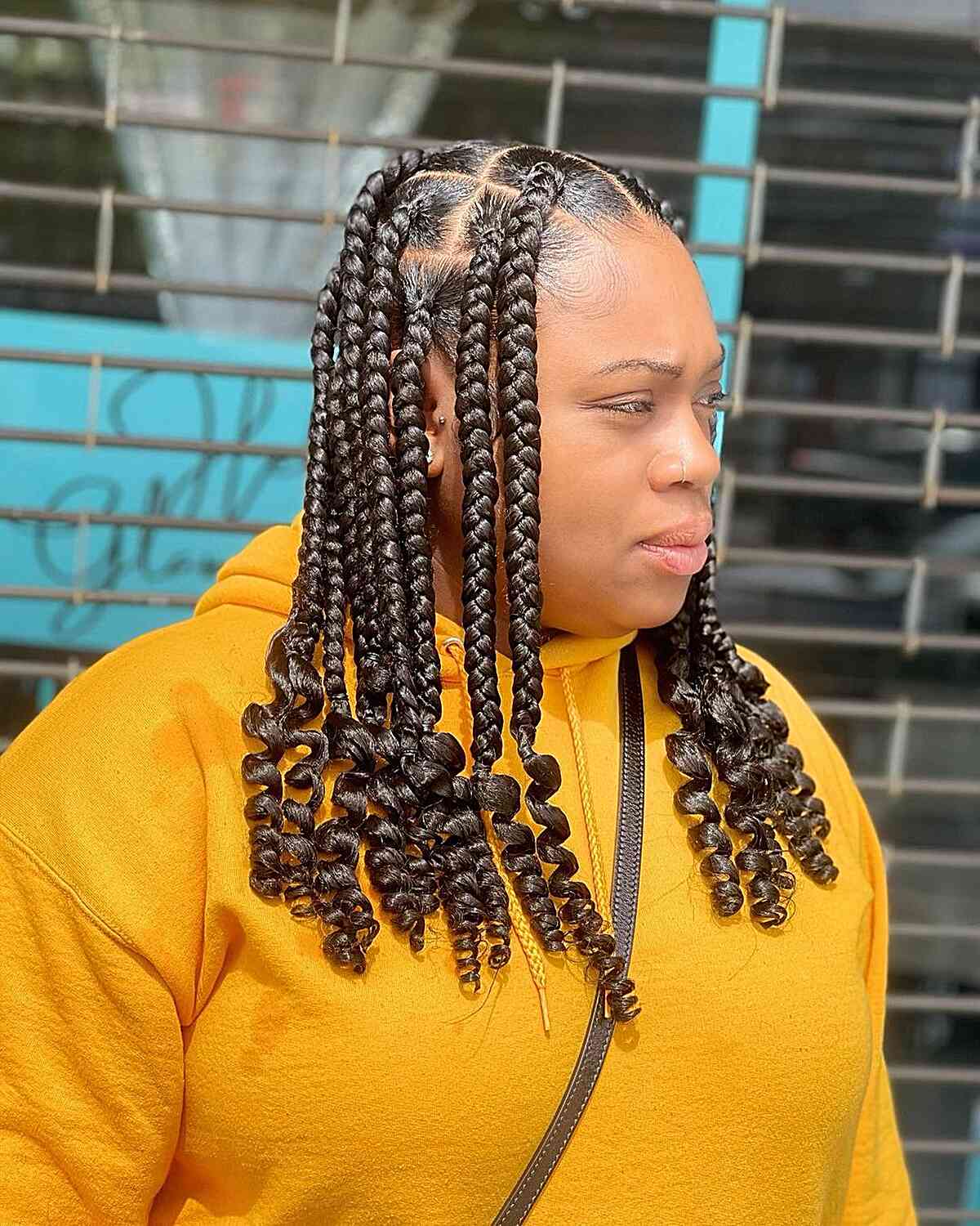 Medium-Length Jumbo Knotless Braids with Sleek Curled Ends