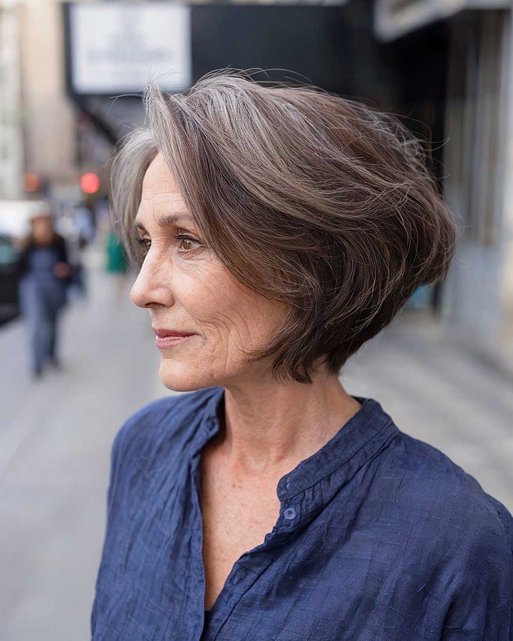 Inverted aircut bob for fine gray hair over 60 with layered fullness and lightweight texture at the back