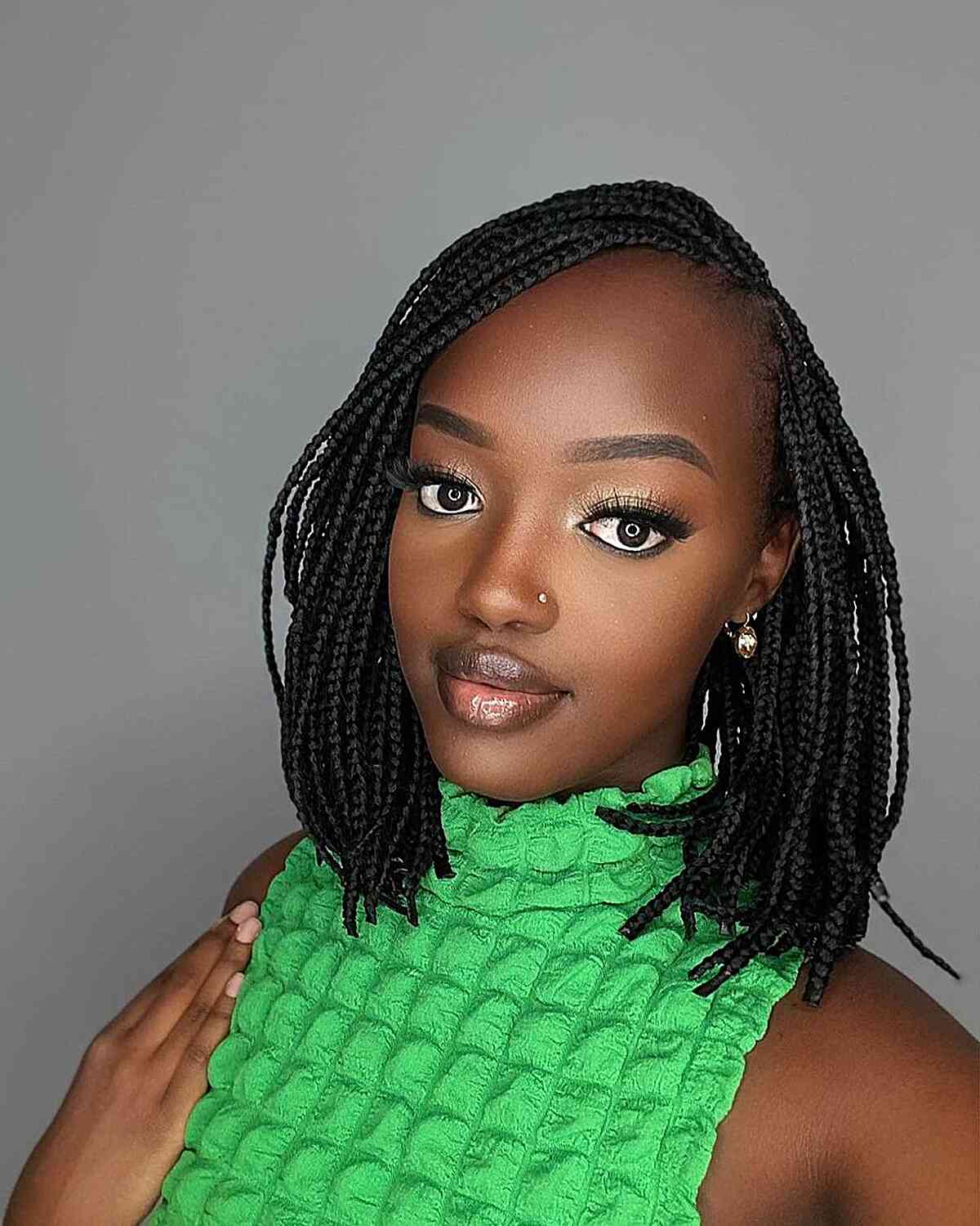 Shoulder-Length Mini Knotless Braids with Deep Side Part Style for Black Women