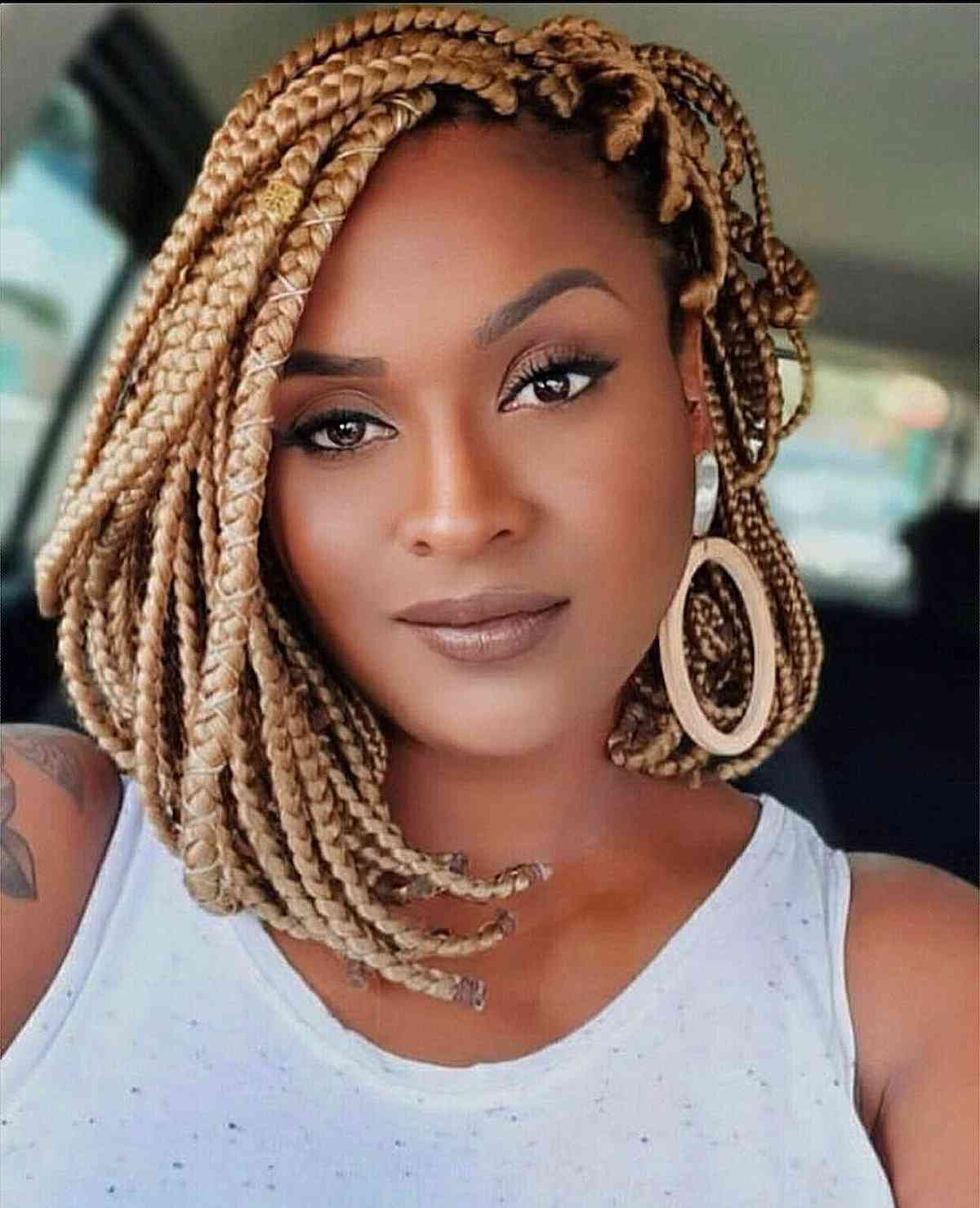 Warm short blond box braids