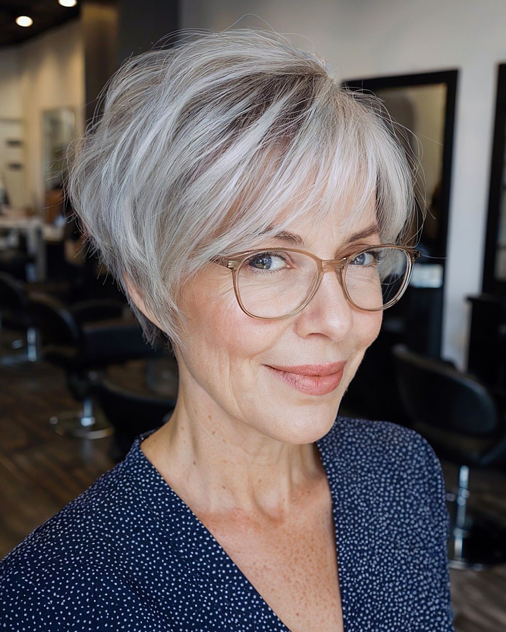 Tapered silver pixie bob for over 60 with wispy layers and soft volume around the crown