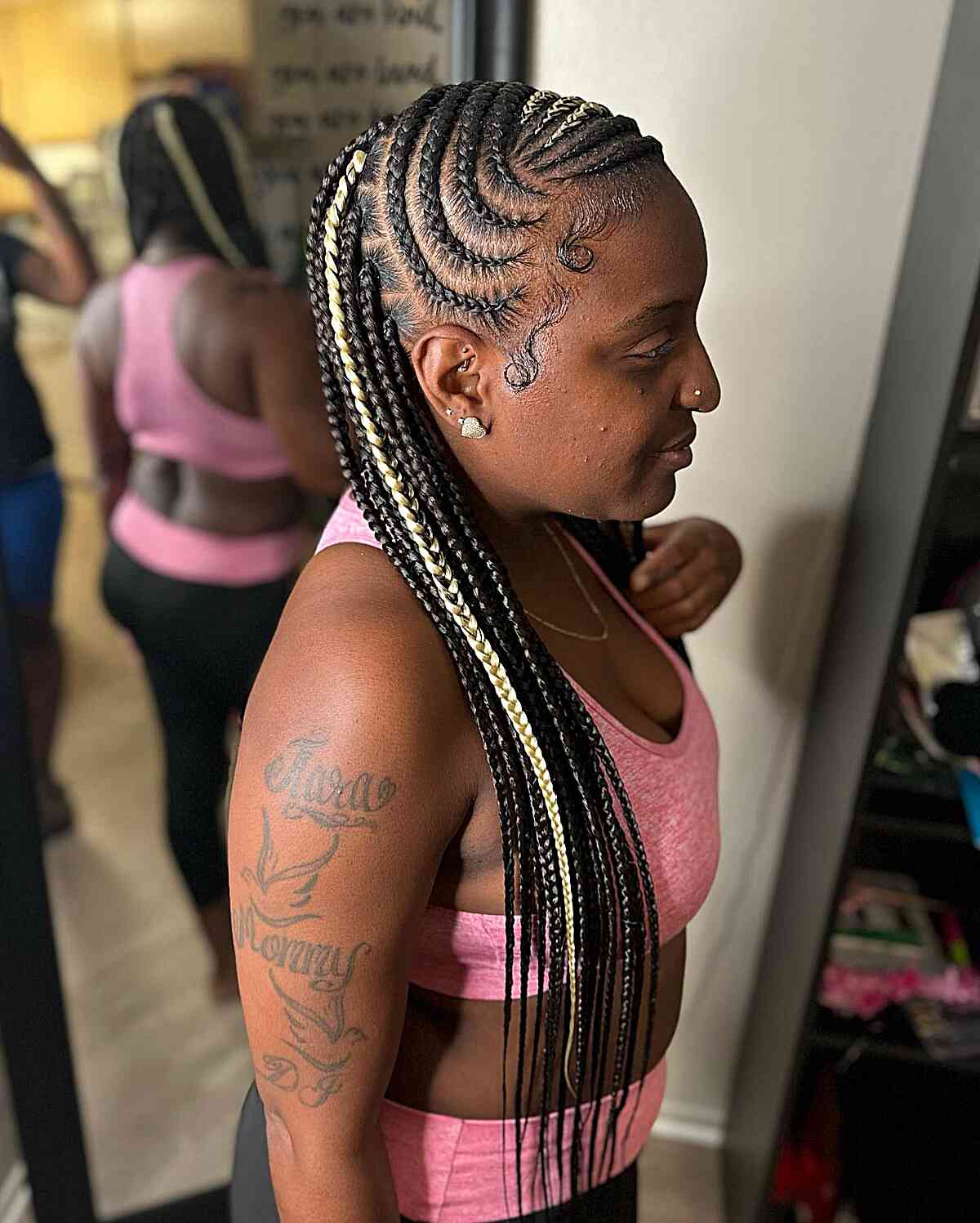 The curved lemon juice braids are very long with a blond accent
