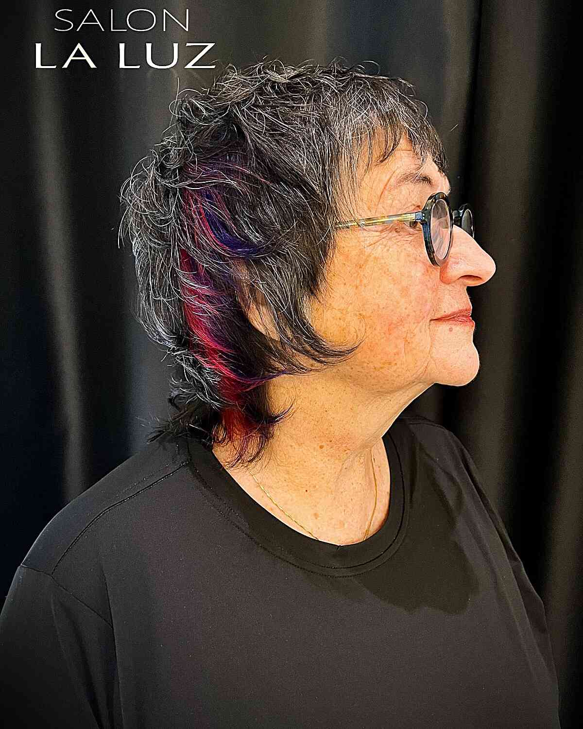 Short Shag for Dark Hair with Pink and Purple Streaks on Seniors Over Sixty with Glasses