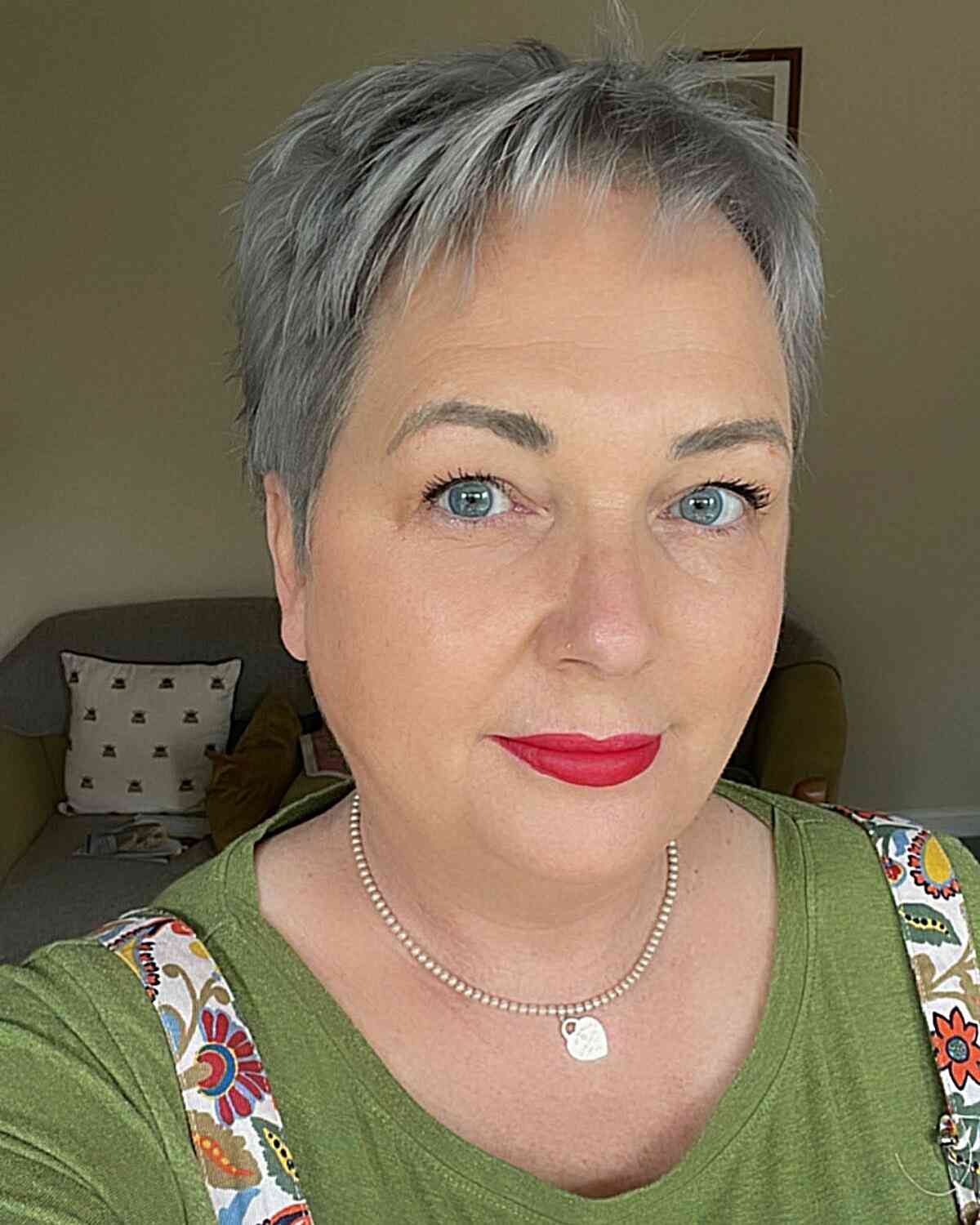Very short pixie for older women over 60 years with gray hair and round faces