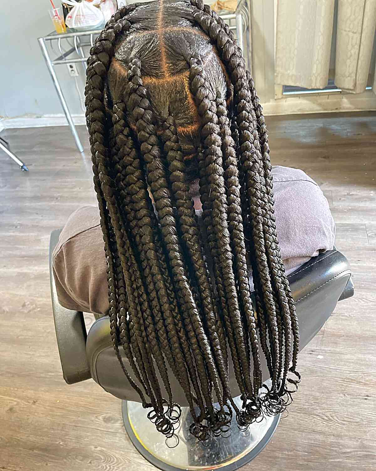 Long poetry braids with curly ends