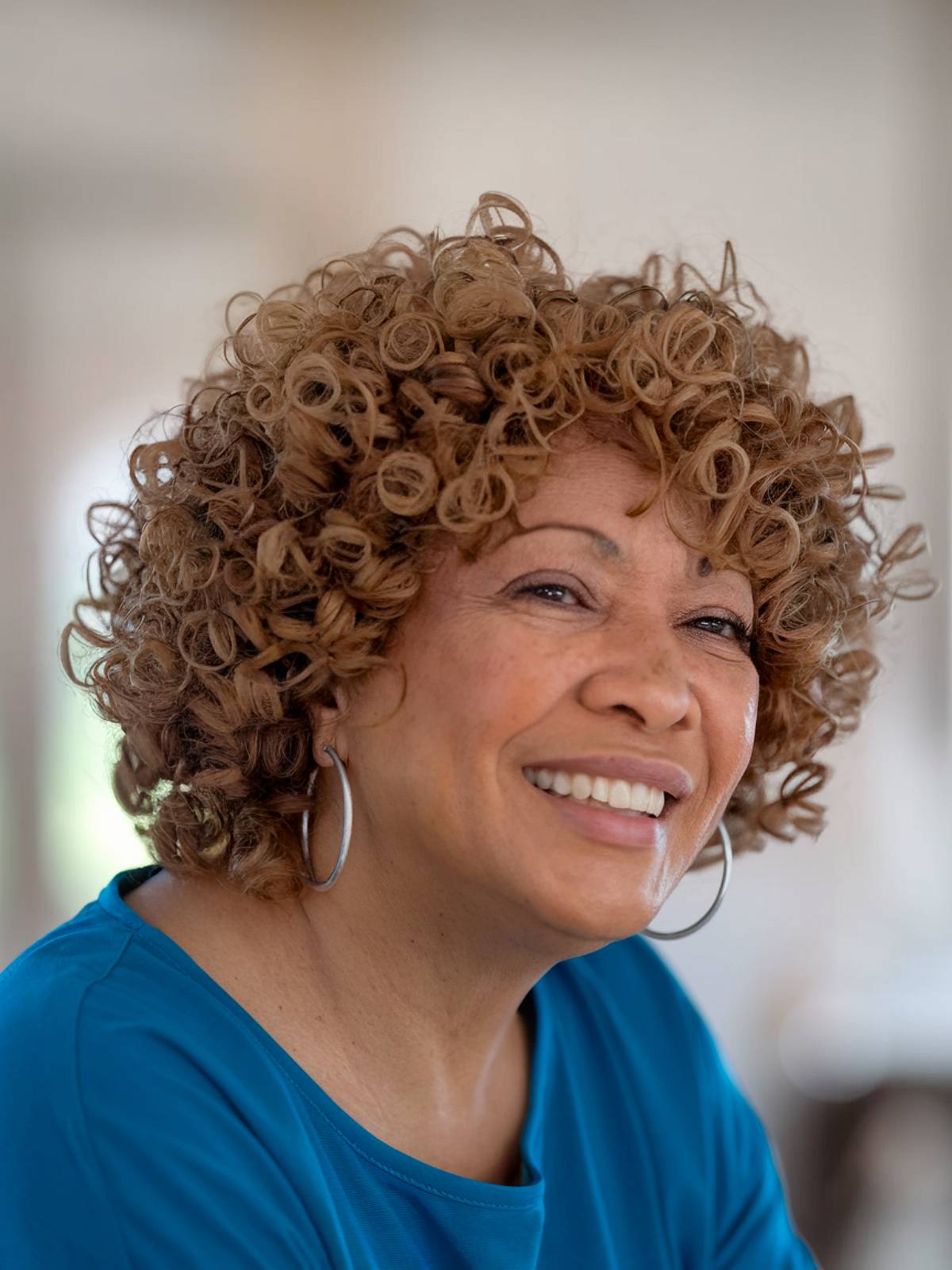 A short natural haircut for black women more than 60 with round faces
