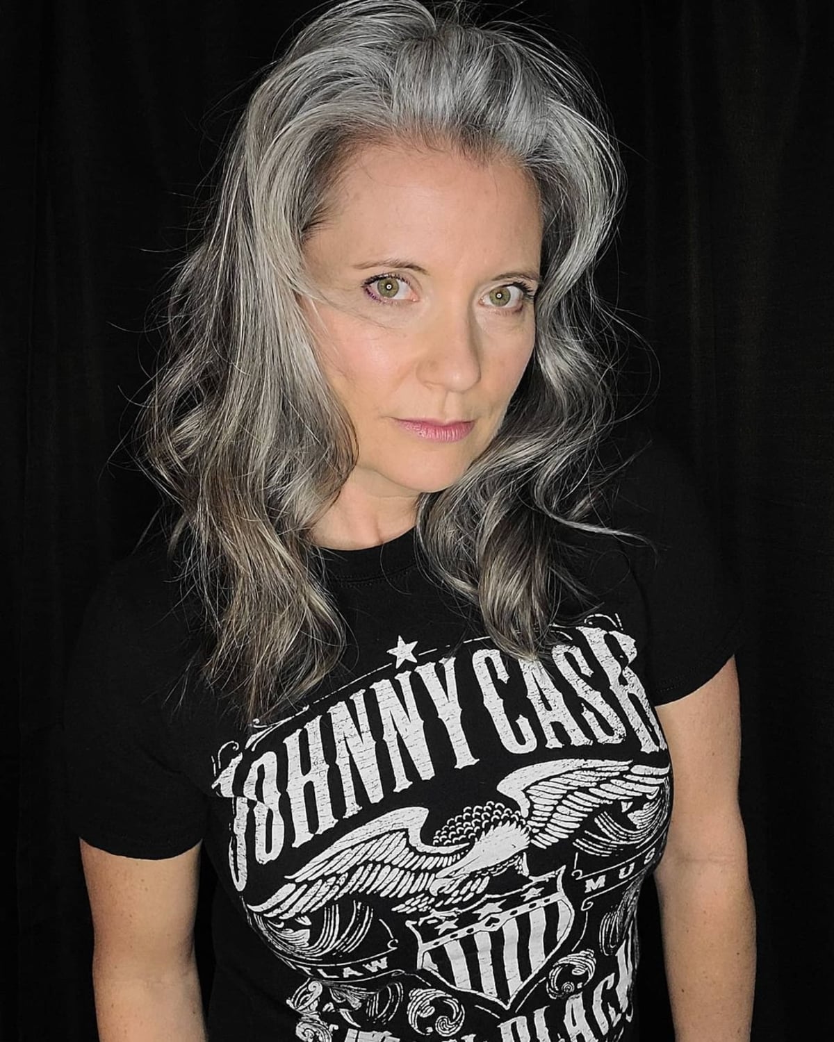 Mid length wavy hair for women over 60 with grey hair