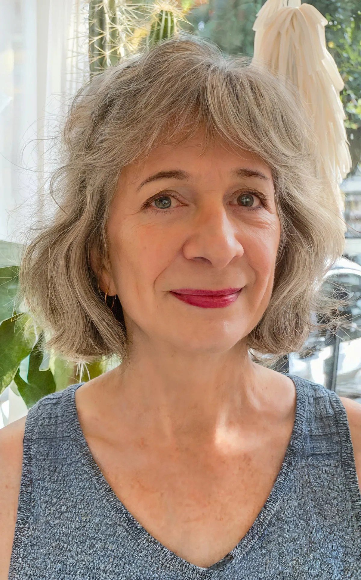 Short Shaggy Pixie Bob with Bangs for Women Over 60 with Grey Thick Hair