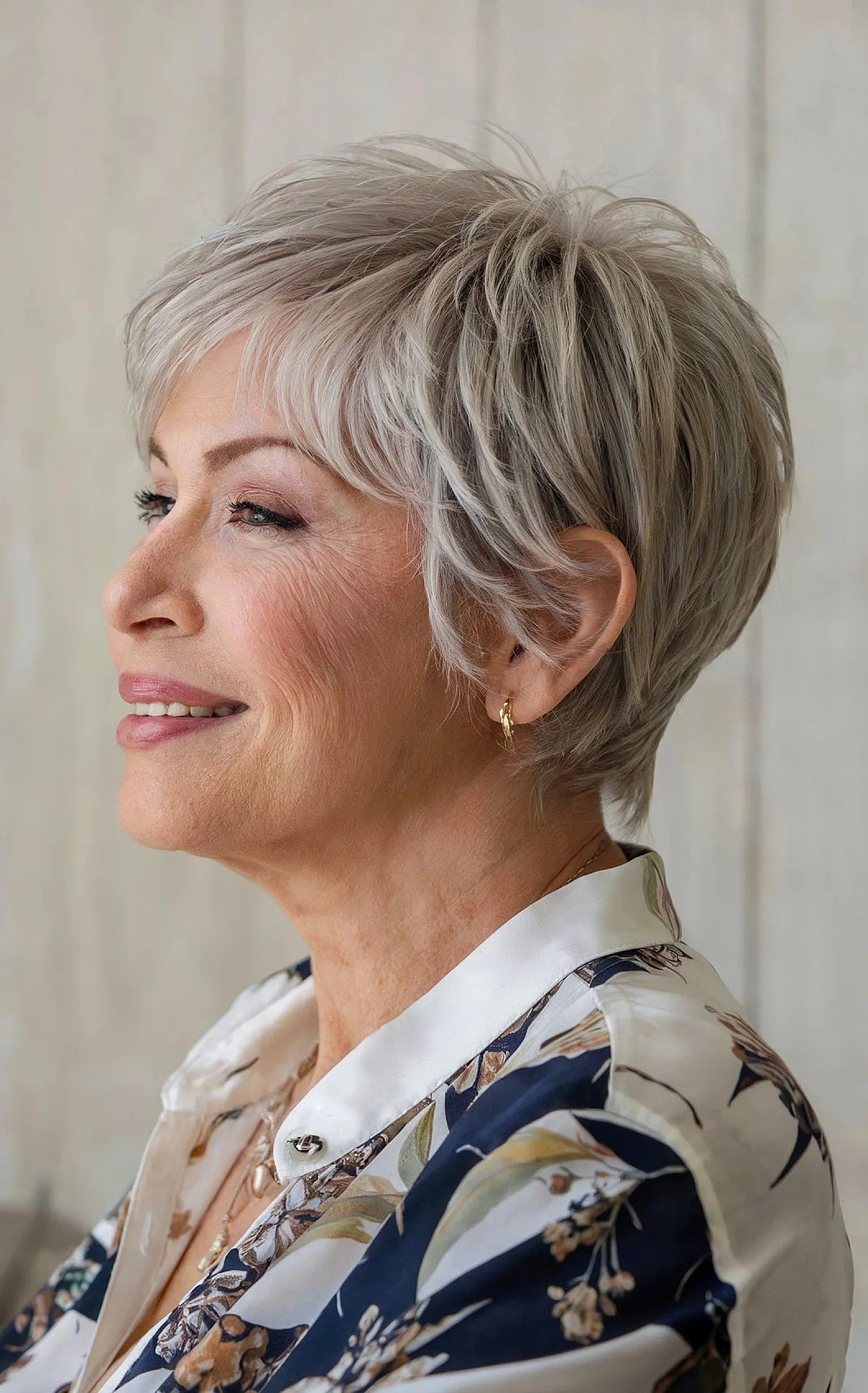 A very short gray pixy pixel on women with gray hair, who is more than 60 years old