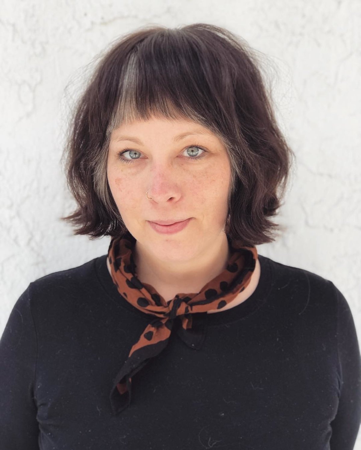 Medium -length pieces of thin hair and a round face for older women