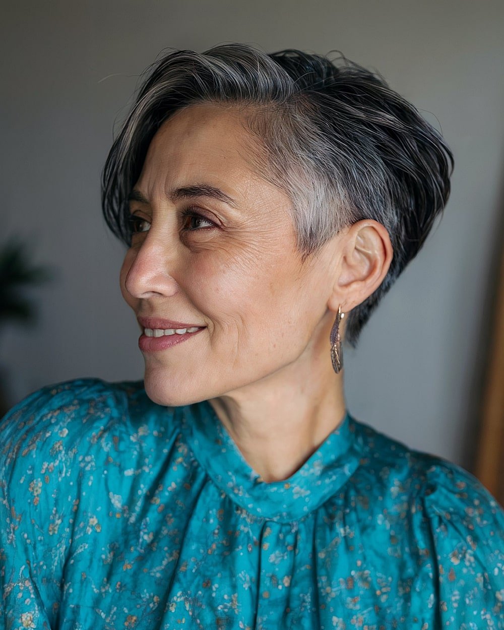 Short tapered cut with grey fade on dark hair, sleek silhouette ideal for naturally coarse or thick textures
