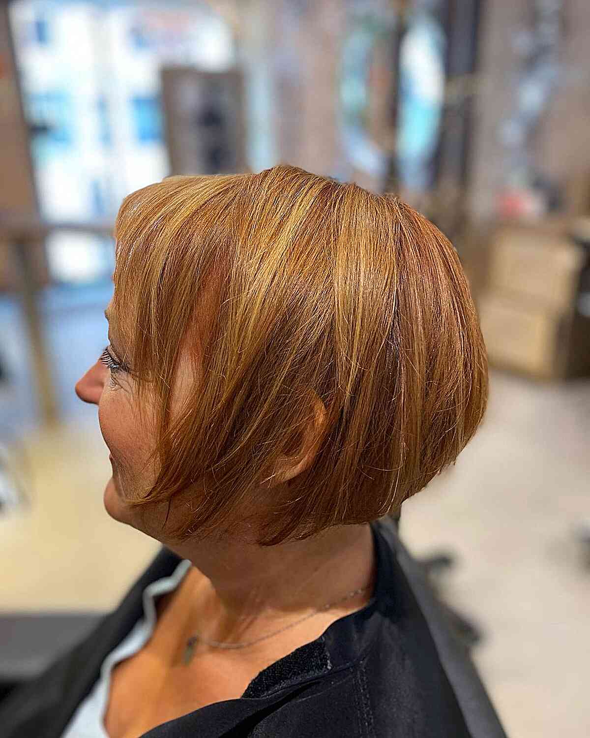 Warm strawberry tone similar to the older women over 60 short hair