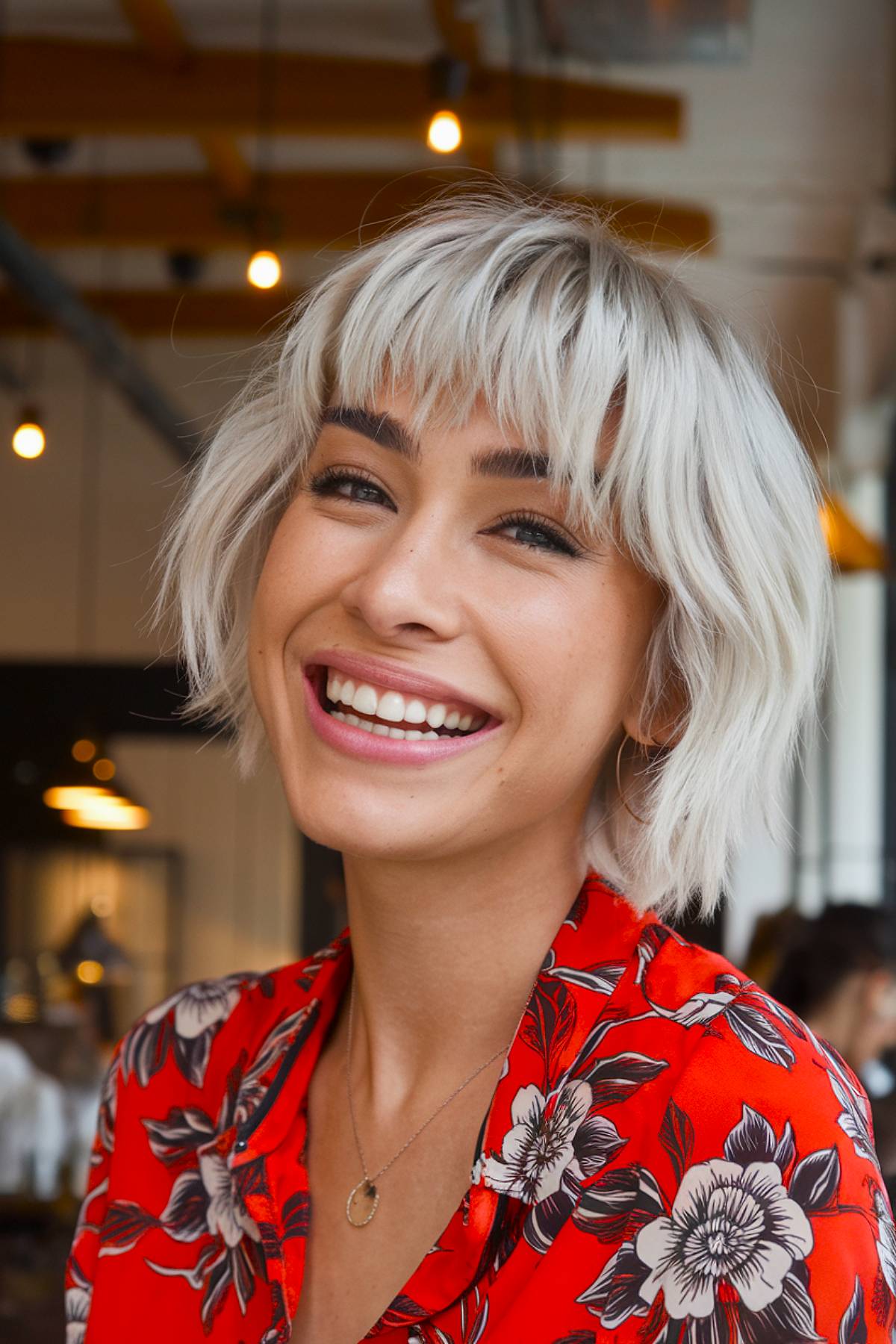 Endgy Platinum Blonde Bob with chopped pony for a bold, statement-made look