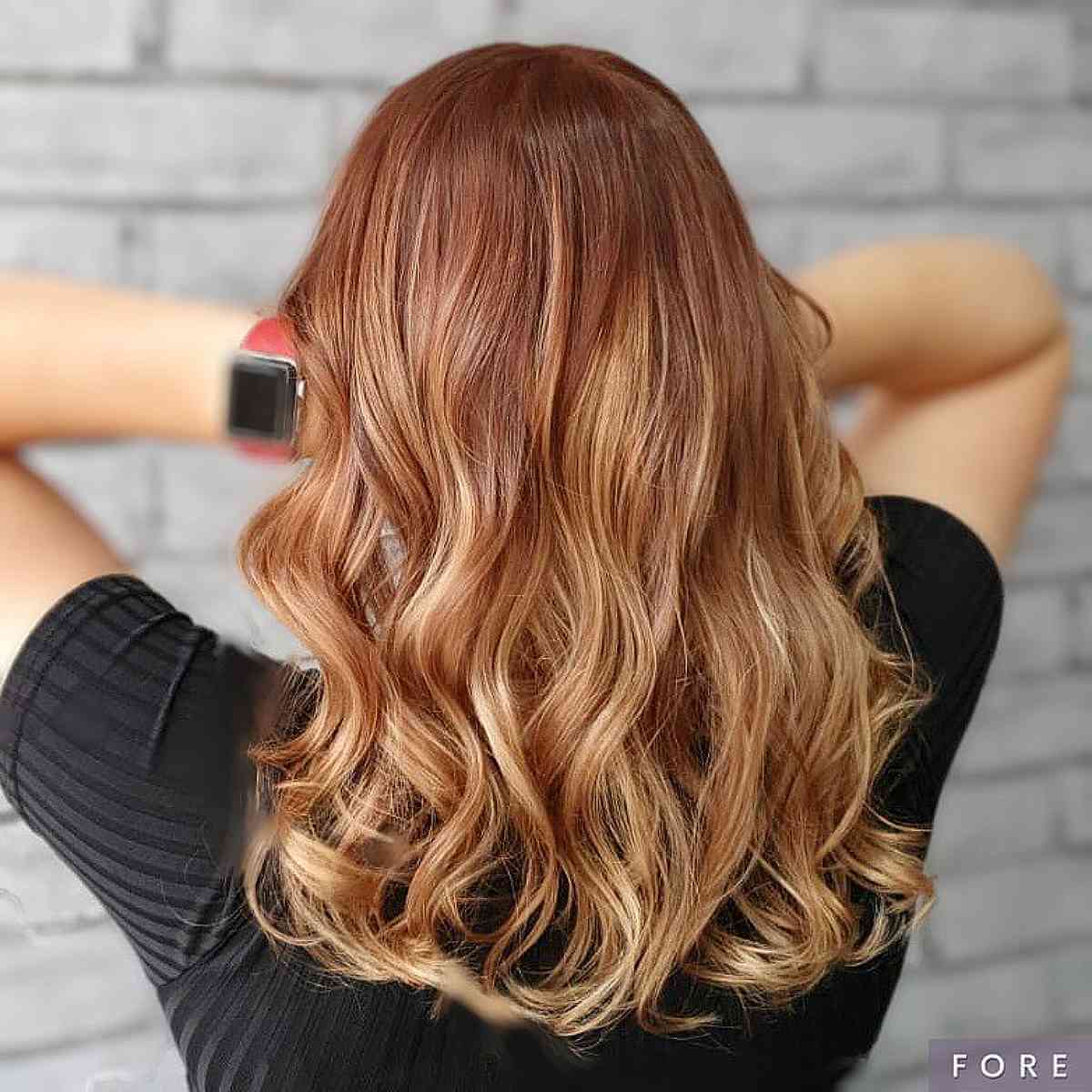 Dark strawberry blonde with subtle Balayage highlights