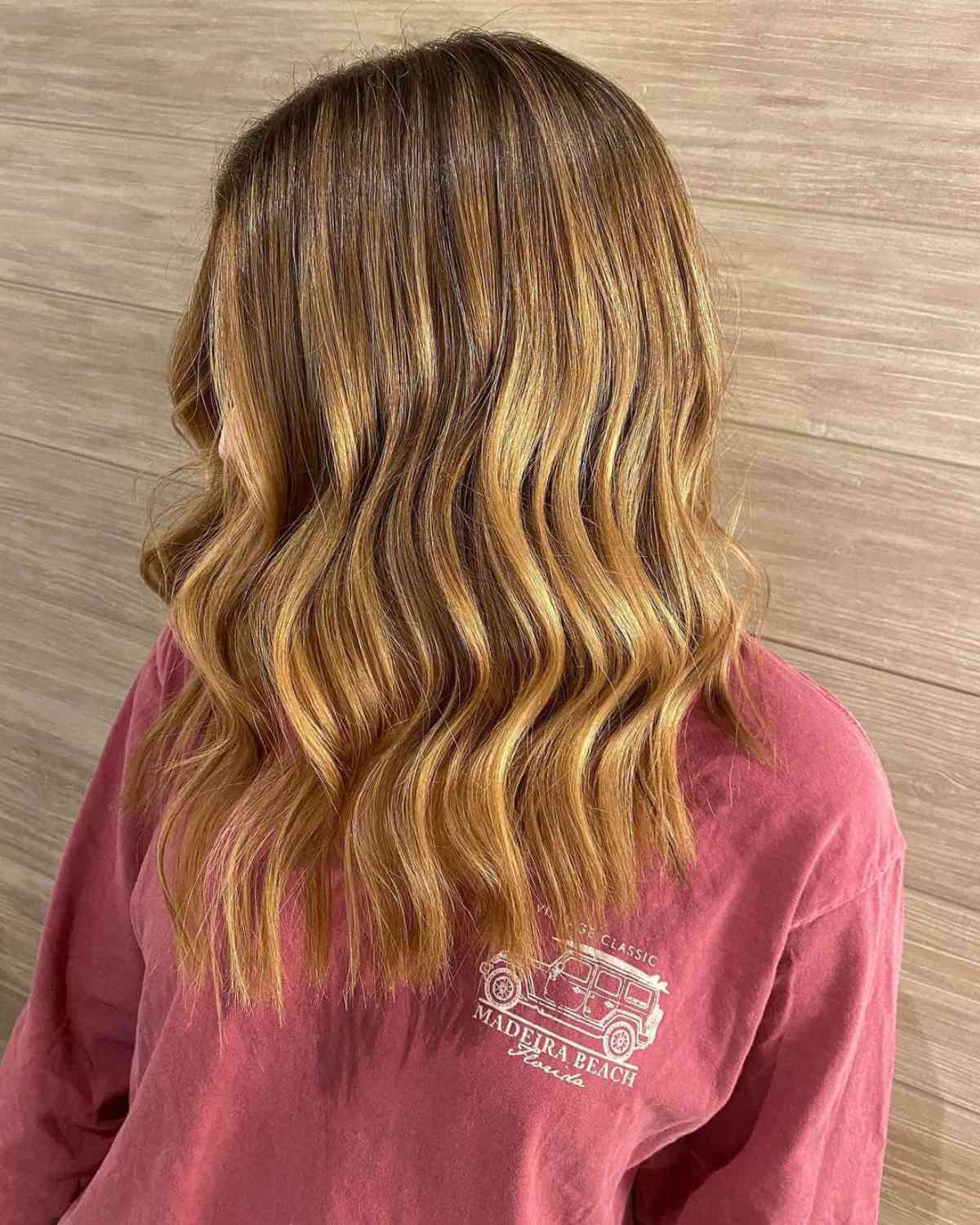 Golden honey strawberry blonde Balayage with dark roots