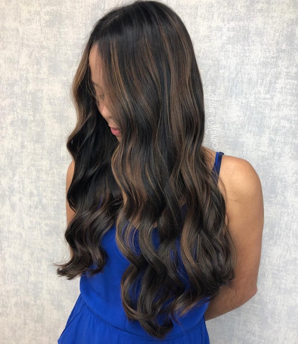 Black hair with light caramel highlights