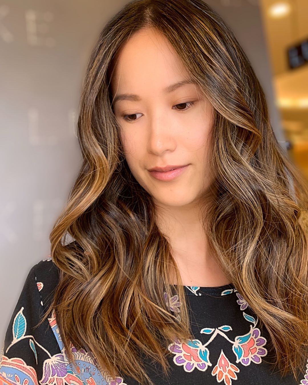 Romantic light brown hair with caramel highlights