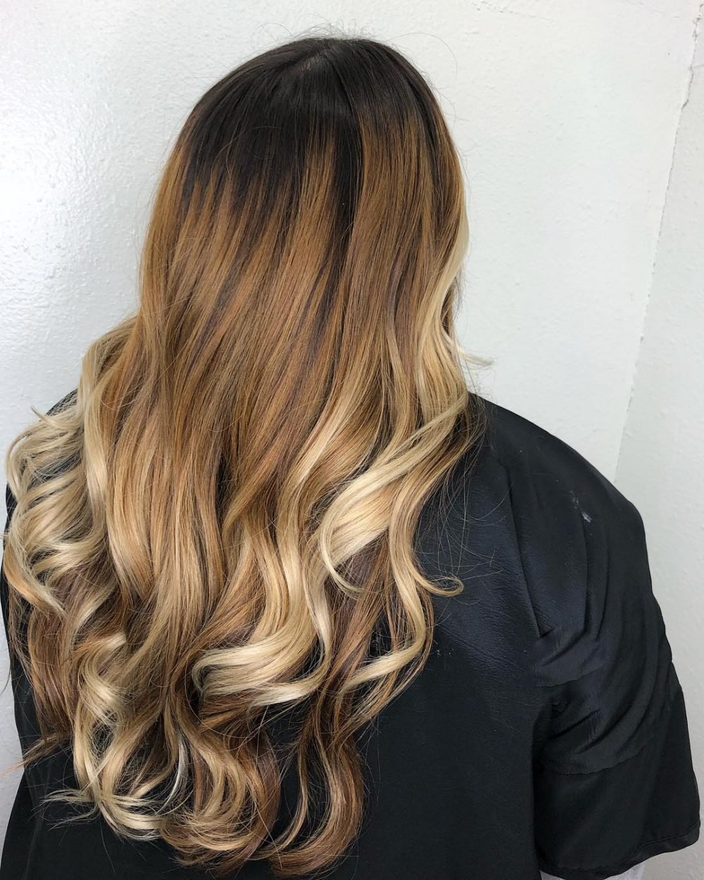 Dark to light caramel ombre on natural brunettes hair