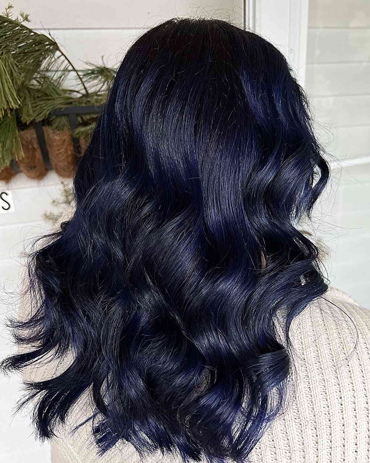 Deep indigo blue with dark roots