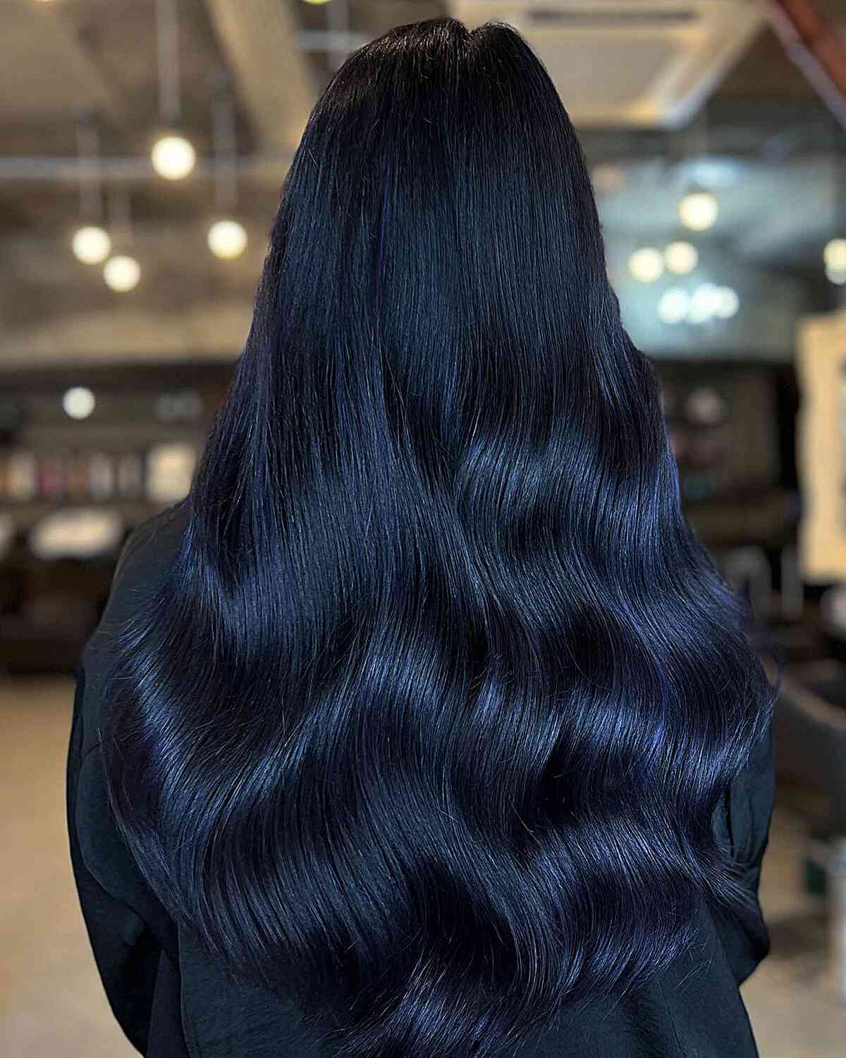 Dark and shiny blue on long waves hair
