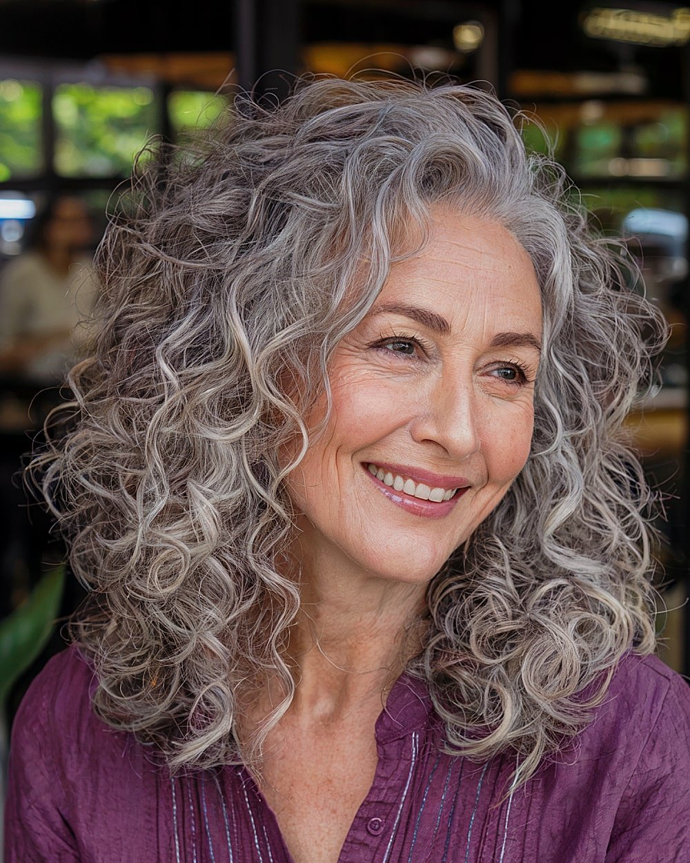 Medium length curly shave with layers of size and bounced on gray hair