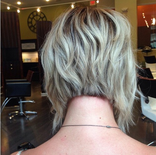 An angle, short -layer bob shave