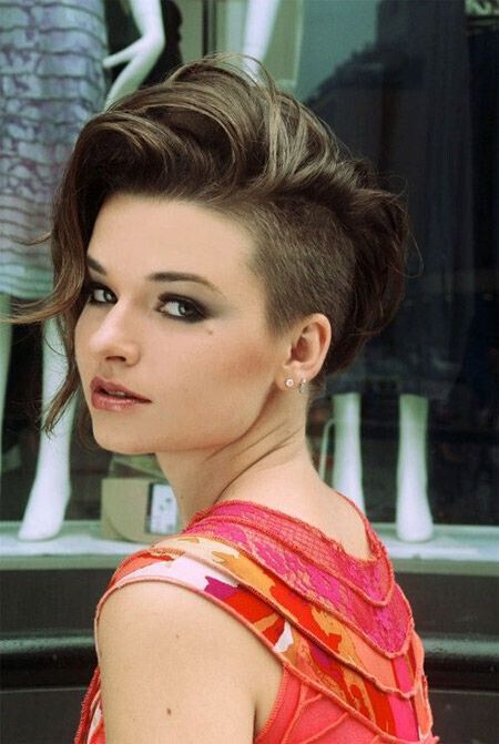 A short, asymmetric haircut with curly hair