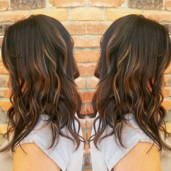 The caramel highlights dark brown hair