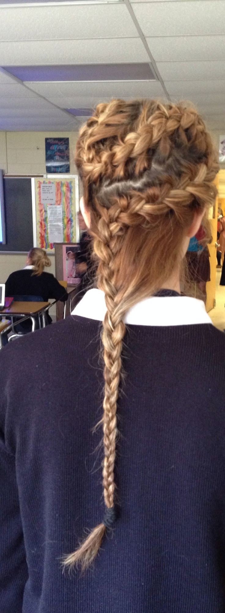 A cool, curved French braid with a regular braid for long hair
