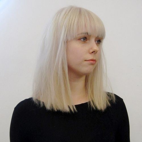 Cute girl hairstyle with sharp bangs - medium -length haircuts for tender hair