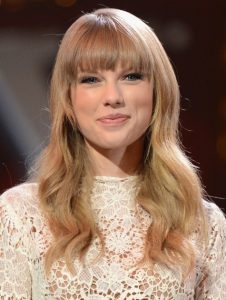 Long Hairstyles for Blunt Bangs: Taylor Swift Wavy Hair Style