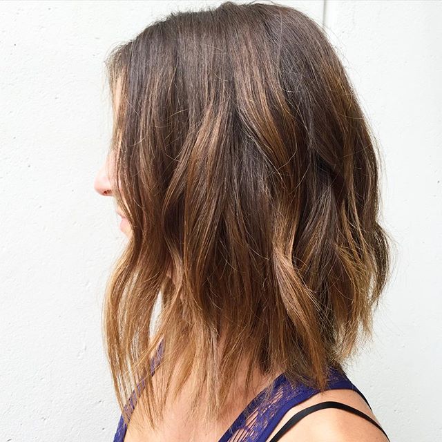 Medium length bob hairstyle with the most prominent prominent caramel
