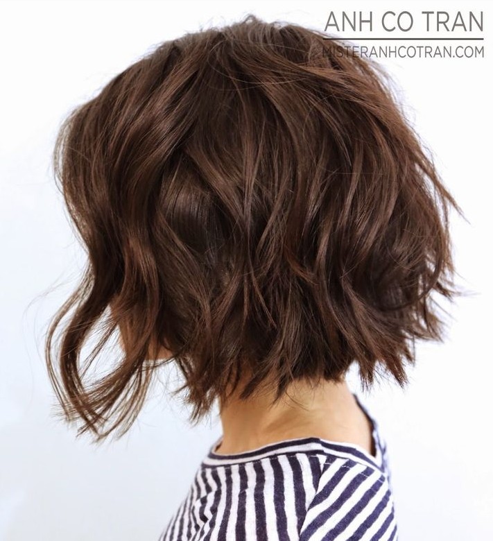 A side view of a short wavy bob haircut