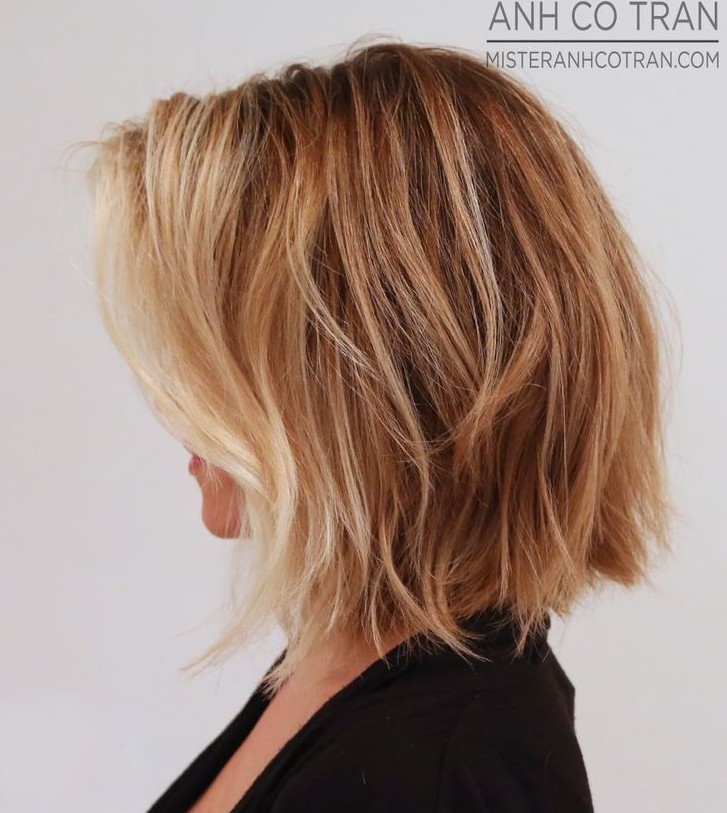 A side view of a soft, wavy bob piece